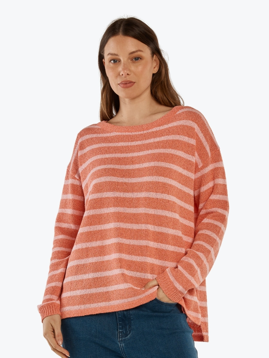 Woman wearing a striped sweater on a white background
