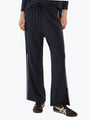 Navy blue wide-leg pants with a white stripe on a white background