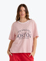 Woman wearing a striped t-shirt with text on a white background