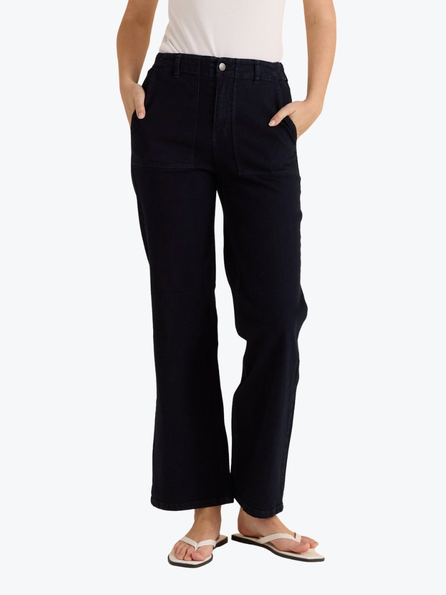 Person wearing black pants on a white background