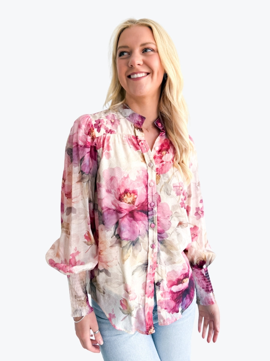 Woman wearing a floral blouse on a white background