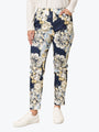 Floral-patterned pants worn by a person on a white background