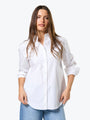 Woman wearing a white shirt on a white background