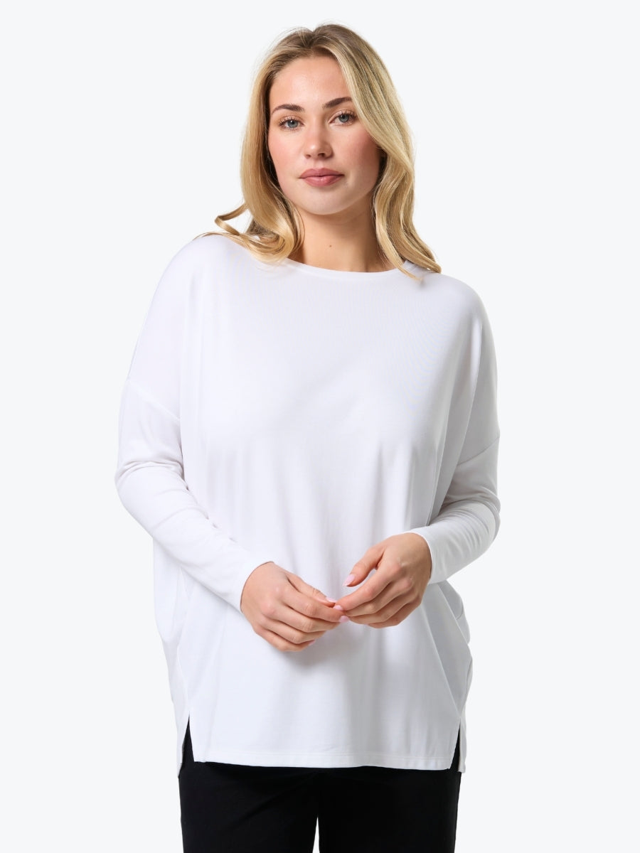 Woman wearing a white sweater on a white background