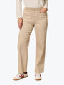 Person wearing beige pants with a white background