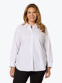 Woman wearing a white button-up shirt on a white background