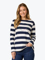 Woman wearing a navy and white striped sweater with a stitched heart