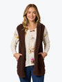 Woman wearing a brown hooded vest over a floral blouse on a white background