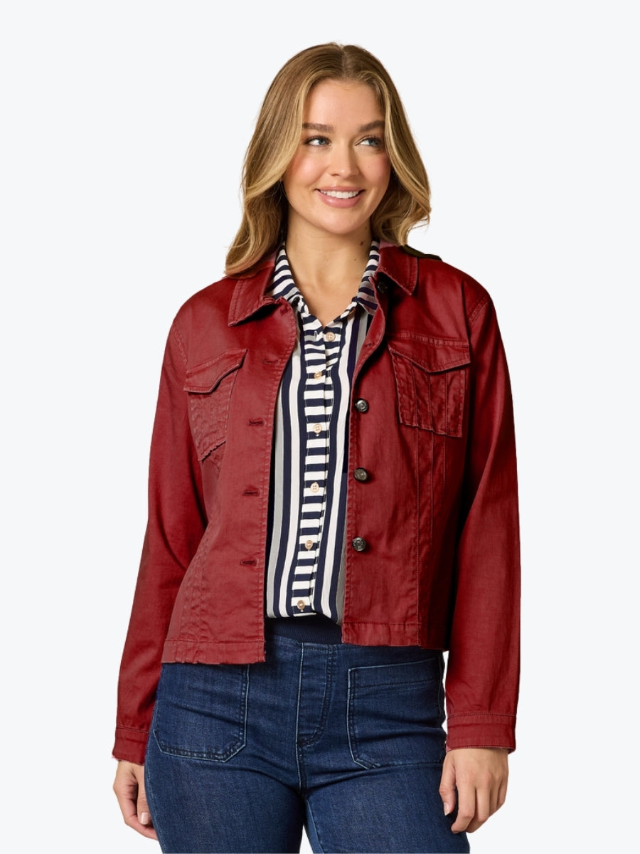 Woman wearing a shiraz jacket over a striped shirt on a white background