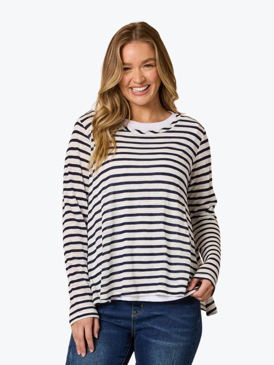 Woman wearing a black and white striped long-sleeve shirt on a white background