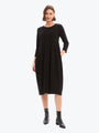Woman wearing a black dress on a white background