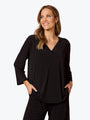 Woman wearing a black outfit on a white background